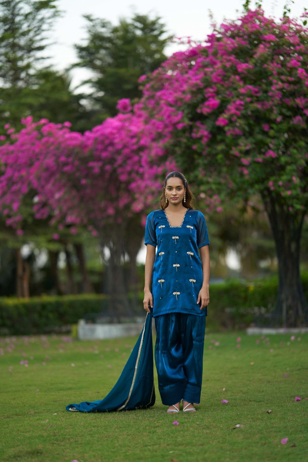 Woman wearing a blue salwar suit set
