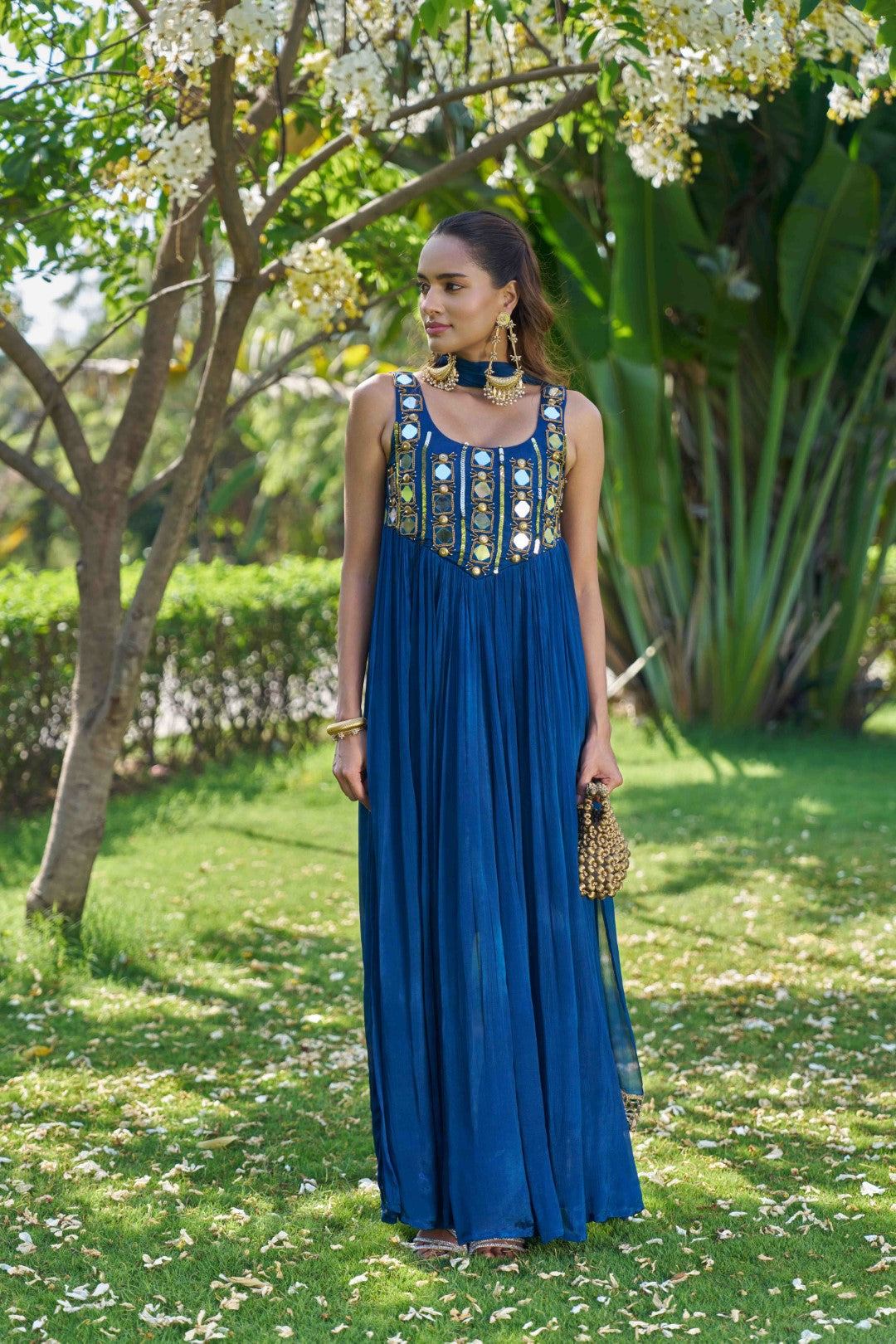 Woman wearing a blue Anarkali suit set