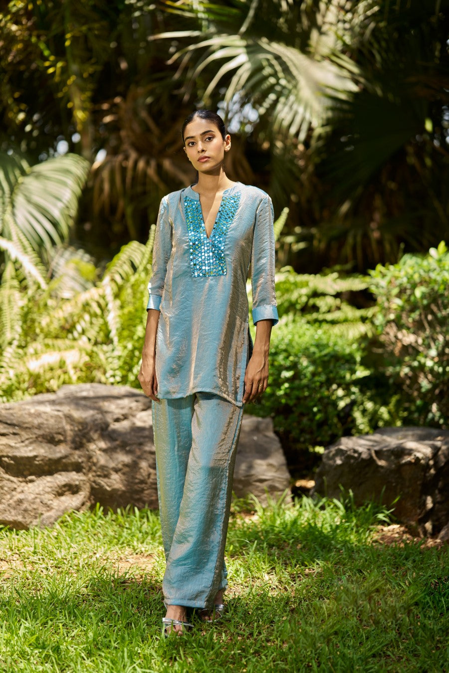 Woman wearing a blue straight suit set